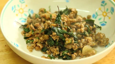 Stir fried minced pork with basil or Padkaprao, Thai famous food. Stock Footage 186065547