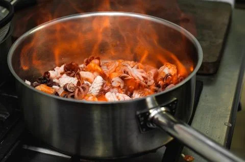 Stir fried mixed seafood. flaming. Selectiva focus Stock Photos