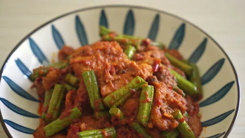 Stir fried pork with red curry paste - Thai food style Video stock 169984602