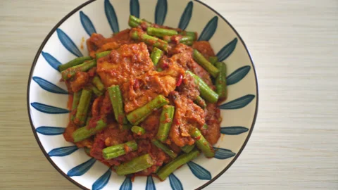 Stir fried pork with red curry paste - Thai food style Stock Footage 169984785