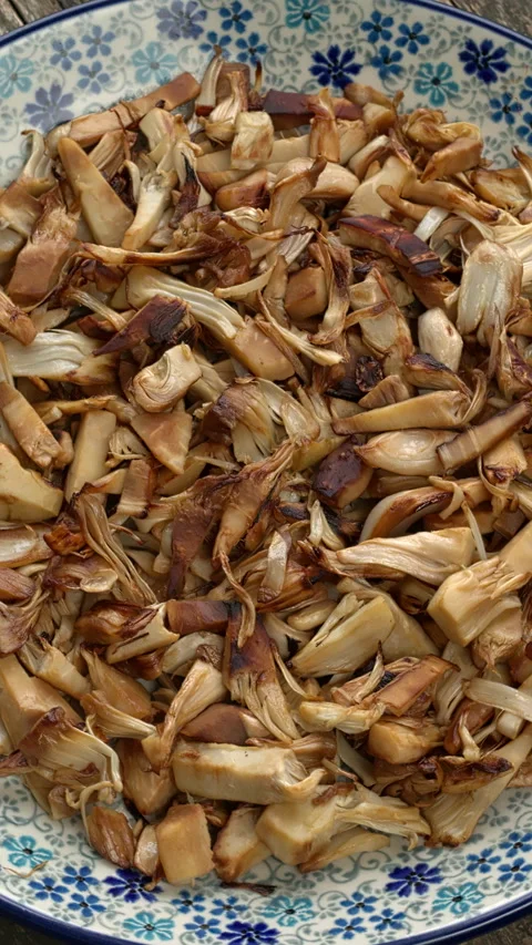 Stir-fried pulled jackfruit with soy sauce jackfruit.  Vertical video. Stock Footage 299929290