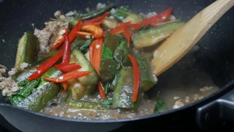 Stir fried  red bell pepper , herbal sweet basil leaves , green sliced piece Stock Footage 89446894