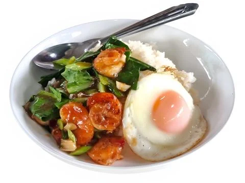 Stir-fried shrimp paste and kale Topped over steamed rice and fried egg. is.. Stock Photos