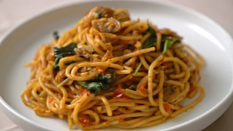 Stir Fried Spaghetti with Clam and Chilli Paste - Fusion food style Stock Footage 158630673