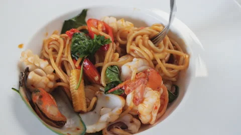 Stir-fried spicy seafood spaghetti on plate of cuisine Stock Footage 155430053