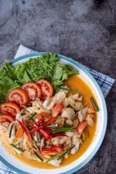 Stir-fried squid with salted egg yolk, onion, spring onion and Chili pepper o Stock Photos