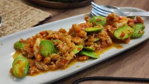 Stir Fried Stink Bean (Bitter Bean) with Shrimps and Shrimp Paste (Goong Pa.. Stock Footage 254311293