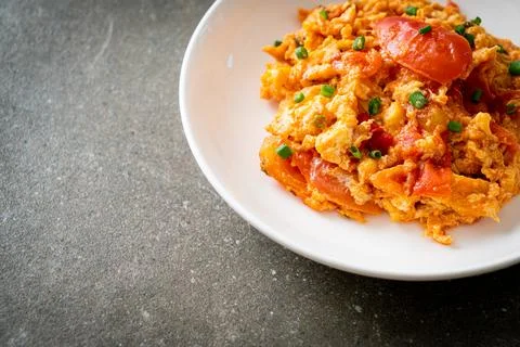 Stir-fried tomatoes with egg or Scrambled eggs with tomatoes Stock Photos