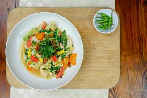 Stir fried vegetable on the white plate also wooden board Stock Photos