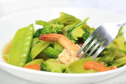 Stir-fried vegetables with fork Stock Photos