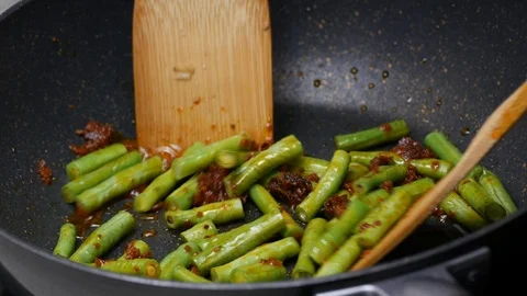 Stir fried yard long beans , the spices , curry paste  , food palm oil  toget Stock Footage 89491080