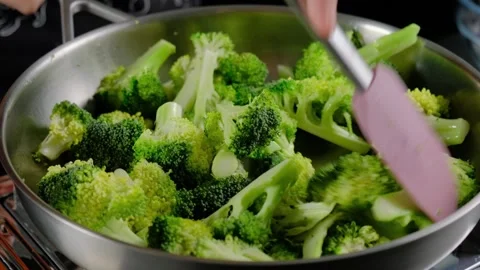 Stir-Frying Broccoli in Large Pan Cooking Kitchen Video stock 341443136