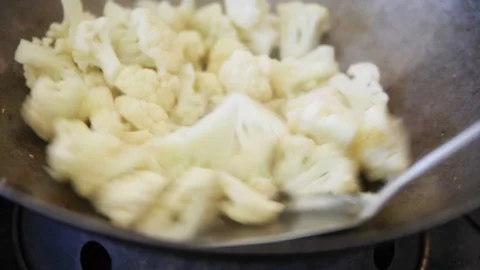 Stir frying cauliflower Stock Footage 102746681
