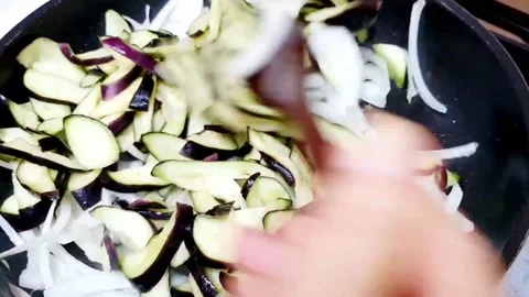 Stir-frying the eggplant Stock Footage 204838591