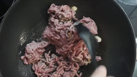 Stir frying meat Stock Footage 97410671