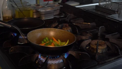 Stir frying with wok Stock Footage 98457816