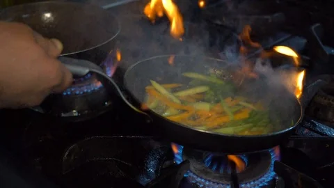 Stir frying with wok Stock Footage 98457858