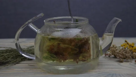 Stir herbal and mint tea with a spoon 스톡 동영상 178425825