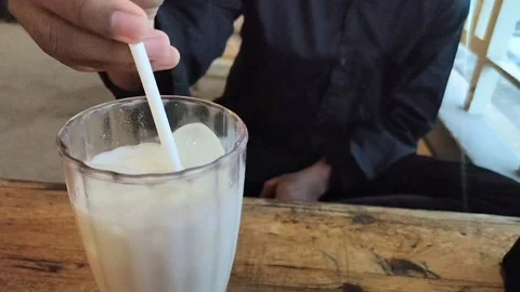 Stir the iced milk drink Stock Footage 227445100