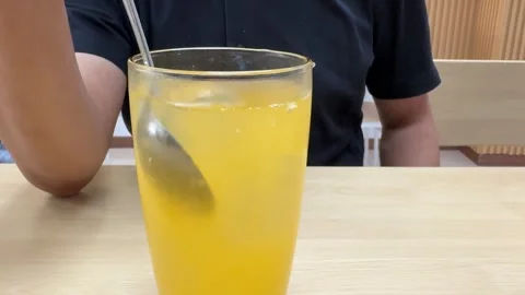 Stir the Orange Juice Stock Footage 311354053