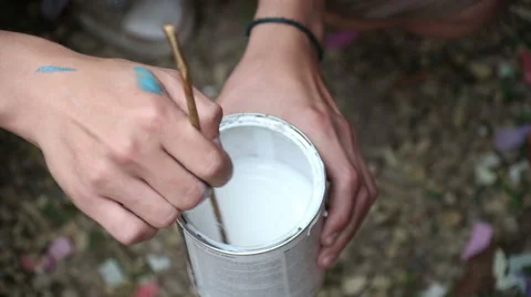 Stir the paint in jar Stock Footage 63823644