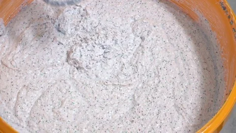 Stir the plaster solution, slow motion 스톡 동영상 73099222