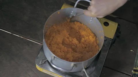 Stir the pumpkin enough to prevent scorching. Process jam in  a deep pot Stock Footage 145743430
