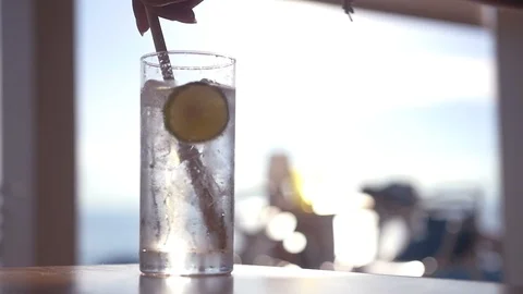 Stir in a refreshing carbonated drink with lime and ice. slow motion, 1920x1080 Stock Footage 96122067