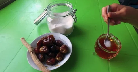Stir sugar in tea, drink tea  Stock Footage 76788619