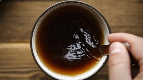 Stir tea with spoon Stock Footage 106147668