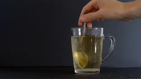 Stir the tea with a spoon Stock Footage 121321855