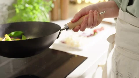 Stirfry in Bright Kitchen Stock Footage 254597599