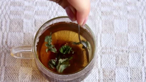 Stiring the hot tea in the cup Stock Footage 66519467