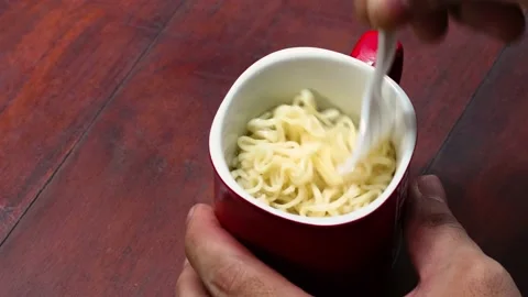 Stiring noodle in the mug Stock Footage 204540923