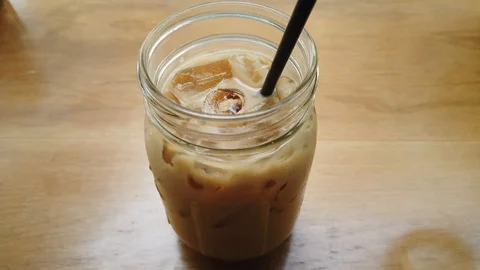 Stirred Iced latte coffee Stock Footage 103457580