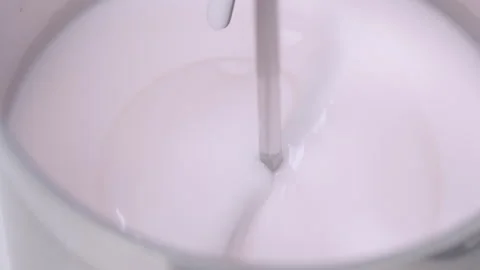 Stirrer Mixing Cream in Laboratory Container Stock Footage 338424059