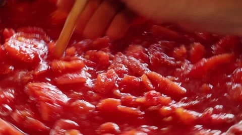 Stirring a batch of stewed tomatoes Stock Footage 41472966