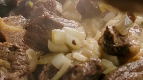 Stirring Beef and Onion in a Pan with a Wooden Spoon Stock Footage 312469070