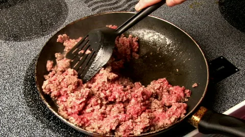 Stirring Beef in Skillet Stock Footage
