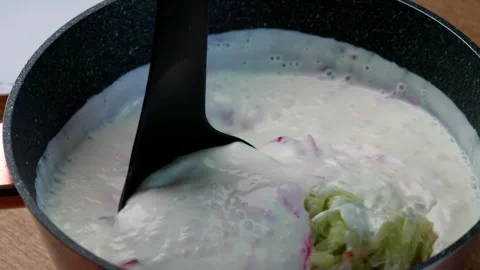 Stirring the beet borscht Stock Footage 320248701