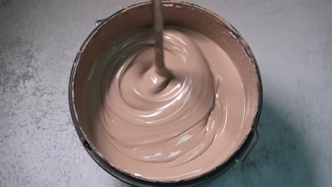 Stirring beige paint. Top view Video stock 293956151