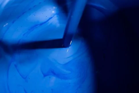 Stirring blue paint Stock Photos