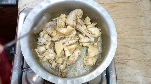 Stirring Boiled Chicken as Broth Dries in Pot, Meal Preparation Close Up Video stock 323351992