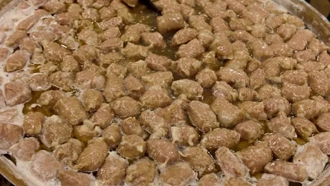 Stirring Boiling Pork Intestines in Large Cauldron at Thai Street Food Market 動画素材 340350993