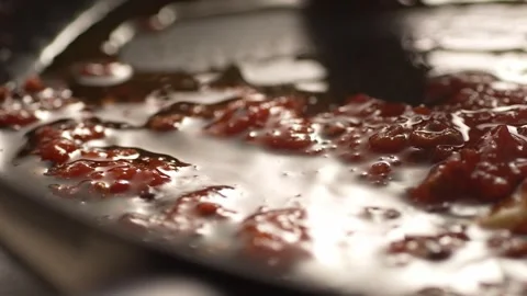 Stirring Bubbling tomato sauce close-up. Stock Footage 266900421