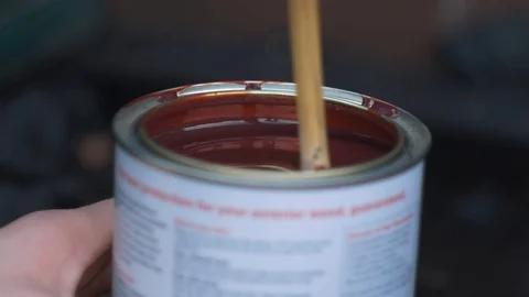 Stirring a can of paint Stock Footage 94636973