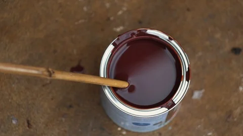 Stirring a can of paint Stock Footage 94636989