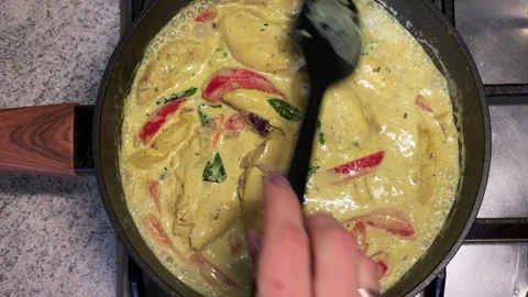Stirring Chicken Curry with Vegetables in Pan Stock Footage 308287583