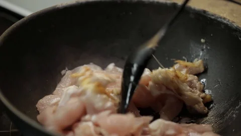 Stirring chicken Stock Footage 98361546