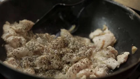 Stirring chicken meat Stock Footage 98361571
